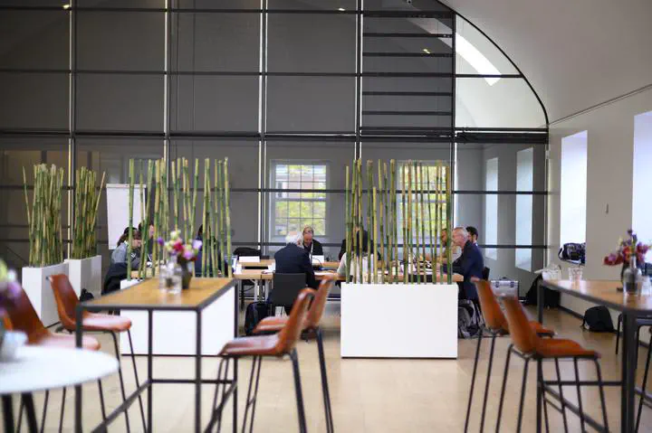 People during a meeting in an open office space